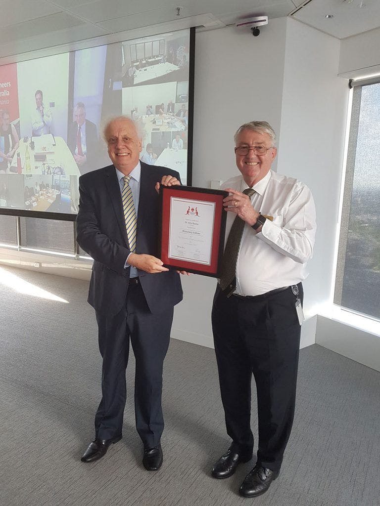 Dr John Baxter receiving his Honorary Fellowship from Engineers Australia’s National President, John McIntosh